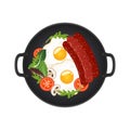 Hot frying pan with fried eggs, sausages, mushrooms, tomatoes and lettuce, top view. Isolated on white background