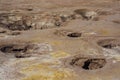 Hot geysers with mud and sulfur crystals in the volcano crater Royalty Free Stock Photo