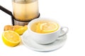 Hot ginger tea with lemon in a cup and filter jar Royalty Free Stock Photo