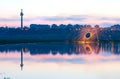 Hot Golden Sparks Flying from Man Spinning Burning Steel Wool near River with Water Reflection Royalty Free Stock Photo