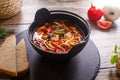 Hot goulash soup in a black pot Royalty Free Stock Photo