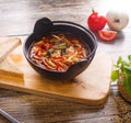 Hot goulash soup in a black pot Royalty Free Stock Photo