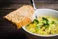 Hot green peas soup on the rustic background Royalty Free Stock Photo