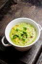 Hot green peas soup on the rustic background Royalty Free Stock Photo