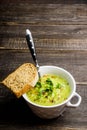 Hot green peas soup on the rustic background Royalty Free Stock Photo