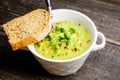 Hot green peas soup on the rustic background Royalty Free Stock Photo