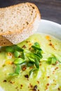 Hot green peas soup on the rustic background Royalty Free Stock Photo