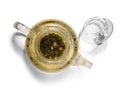 Hot green tea in glass teapot on white background Royalty Free Stock Photo