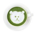 Hot green tea matcha latte cup with cute polar bear face milk foam latte art on top isolated on white background, clipping path i Royalty Free Stock Photo