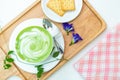 Hot green tea milk with cracker and spoon. on top Royalty Free Stock Photo