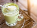 Hot green tea milk in glass mug. Royalty Free Stock Photo