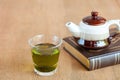 hot green tea with small teapot on wood Royalty Free Stock Photo