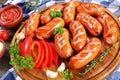 Hot grilled juicy beef sausages, close-up Royalty Free Stock Photo