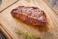 Hot Grilled Whole DenverHot Grilled Whole Denver Steak on Wooden Board with Herbs. Fresh Juicy Medium Rare Beef Royalty Free Stock Photo