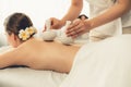 Hot herbal ball spa massage body treatment at day spa . Quiescent