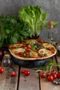 Hot pizza with tomatoes, mozzarella and basil