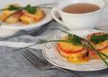 Hot homemade sandwiches with sausage, tomatoes and cheese.Natural healthy food. Sandwiches on a wooden background for tea Royalty Free Stock Photo