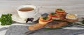 Hot homemade sandwiches with sausage, tomatoes and cheese.Natural healthy food. Sandwiches on a wooden background for tea