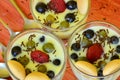 Hot homemade vanilla pudding with strawberries and vine berries