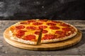 Hot italian pepperoni pizza on wooden table.