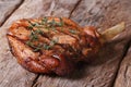 Hot juicy pork steak with thyme on an old table