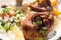 Hot and juicy roasted lamb with greek salad. Authentic Greek food.