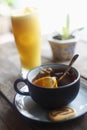 Hot lemon tea and fresh orange juice. Decorative background design