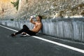 Hot Man Pouring Refreshing Water Over Face After Exercising Outdoors Royalty Free Stock Photo