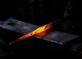 Hot metal rod on an anvil Royalty Free Stock Photo