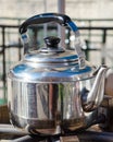 A hot metallic tea kettle Royalty Free Stock Photo