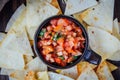 Hot mexican salsa - spicy dip with nachos - chips from corn Royalty Free Stock Photo