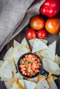 Hot mexican salsa - spicy dip with nachos - chips from corn Royalty Free Stock Photo