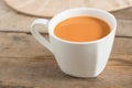 Hot milk tea in a white cup. Selective focus. Royalty Free Stock Photo