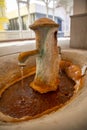 Hot mineral spring in Mill colonnade or Mlynska kolonada in Karlovy Vary spa, Czech Republic Royalty Free Stock Photo