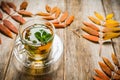 Hot mint tea in glass cup with atmospheric autumn decorations Royalty Free Stock Photo