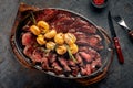 Hot Mix of grilled steaks on a plate with potatoes and rosemary Royalty Free Stock Photo