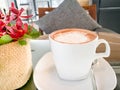 A hot mocha coffee with red orchid on the cozy coffee table Royalty Free Stock Photo