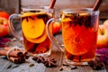 Hot mulled apple cider with cinnamon sticks, cloves and anise