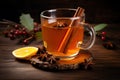 Hot mulled apple cider with with cinnamon sticks, cloves and anise on wooden table Royalty Free Stock Photo