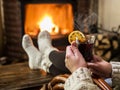 Hot mulled wine and book in woman hands. Royalty Free Stock Photo