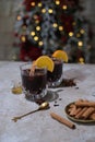 Hot mulled wine with orange, anise,cinnamon with fresh fruits on wooden table. Boceh boceh light backgraund Royalty Free Stock Photo