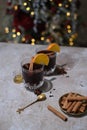 Hot mulled wine with orange, anise,cinnamon with fresh fruits on wooden table. Boceh boceh light backgraund Royalty Free Stock Photo