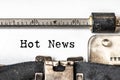 Hot news typed words on a vintage typewriter. Close up Royalty Free Stock Photo