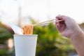 Hot noodle Cup. Noodle cup Ready made. Eating Instant Noodles with a Plastic Fork. Junk food Instant noodles are eating the popula Royalty Free Stock Photo