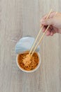 Hot noodle Cup. Noodle cup Ready made. Eating Instant Noodles with a Plastic Fork. Junk food Instant noodles are eating the popula Royalty Free Stock Photo