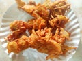 Hot onion bhajjiya bhajiya Indian fast food street food with green pudina chutney on paper plate ready to eat yummy tastey food Royalty Free Stock Photo