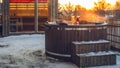 Hot outdoor wooden bath tub on terrace of private house. Finnish sauna Royalty Free Stock Photo