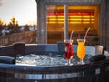 Hot outdoor wooden bath tub on terrace of private house. Finnish sauna Royalty Free Stock Photo