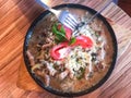 Hot pan with potatoes, meat, gravy and tomatoes Royalty Free Stock Photo