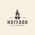 Hot pan with spatula fire food logo design vector graphic symbol icon illustration creative idea